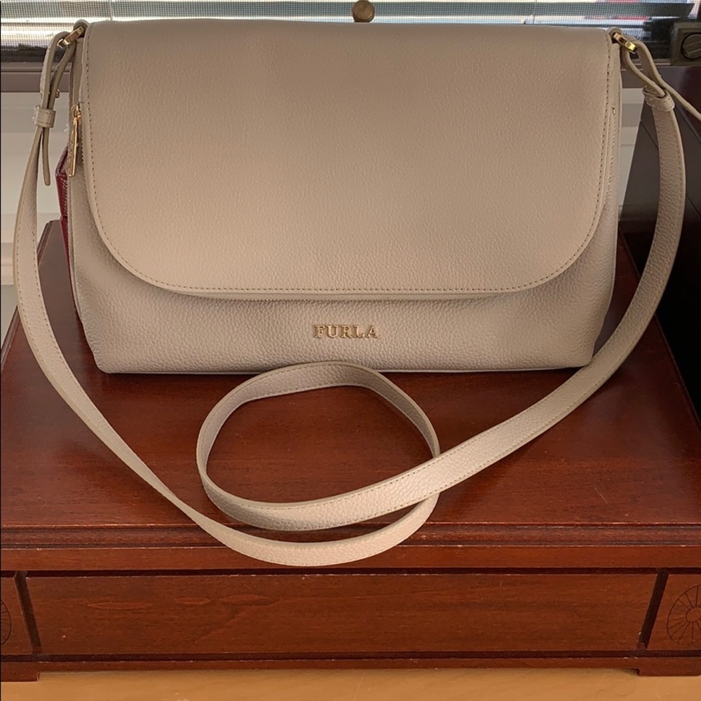 Never used Furla crossbody double pocket bag.